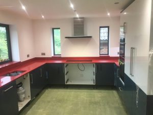 rosso stella red starlight quartz worktops in grey kitchen