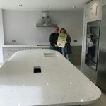 attica white carrera white quartz in kitchen with island