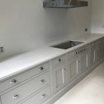 attica white carrera white quartz in kitchen with island