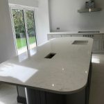 attica white carrera white quartz in kitchen with island