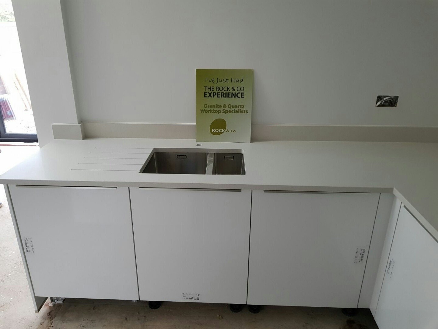 bianco de lusso quartz worktops with wooden breakfast bar