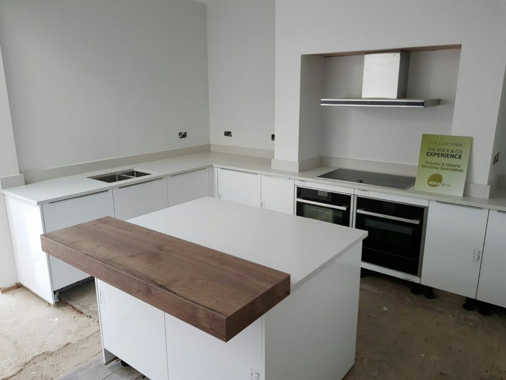 bianco de lusso quartz worktops with wooden breakfast bar