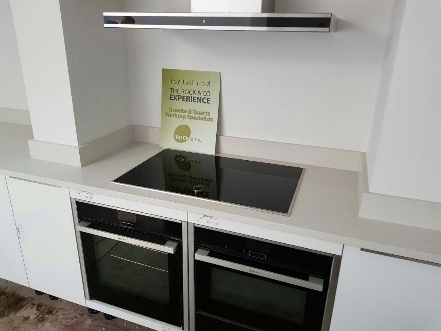 bianco de lusso quartz worktops with wooden breakfast bar