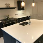 bianco puro white quartz worktops in traditional blue kitchen