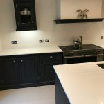 bianco puro white quartz worktops in traditional blue kitchen