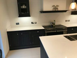 bianco puro white quartz worktops in traditional blue kitchen