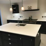 bianco puro white quartz worktops in traditional blue kitchen