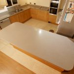 nebbia grigia quartz worktops installed in oak kitchen