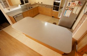 nebbia grigia quartz worktops installed in oak kitchen