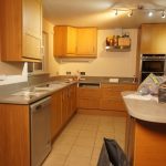 nebbia grigia quartz worktops installed in oak kitchen