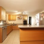 nebbia grigia quartz worktops installed in oak kitchen