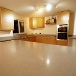 nebbia grigia quartz worktops installed in oak kitchen