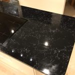 nero venata black quartz worktops in kitchen