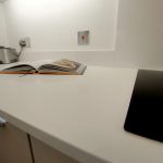 bianco puro pure white quartz worktops in taupe high gloss kitchen