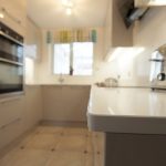 bianco puro pure white quartz worktops in taupe high gloss kitchen