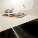 bianco puro pure white quartz worktops in taupe high gloss kitchen