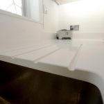 bianco puro pure white quartz worktops in taupe high gloss kitchen