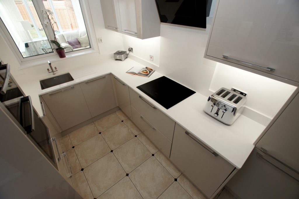 bianco puro pure white quartz worktops in taupe high gloss kitchen