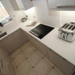 bianco puro pure white quartz worktops in taupe high gloss kitchen