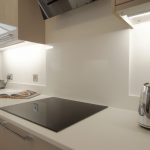 bianco puro pure white quartz worktops in taupe high gloss kitchen