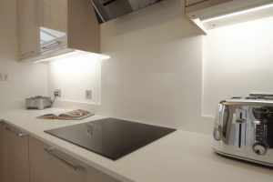 bianco puro pure white quartz worktops in taupe high gloss kitchen