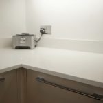 bianco puro pure white quartz worktops in taupe high gloss kitchen