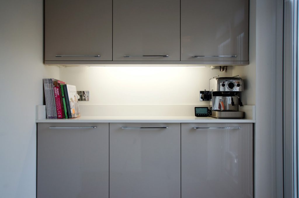 bianco puro pure white quartz worktops in taupe high gloss kitchen