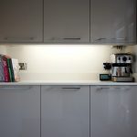 bianco puro pure white quartz worktops in taupe high gloss kitchen