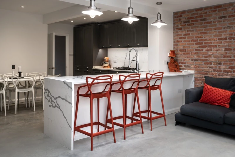 Rock & Co dark kitchen with waterfall worktop