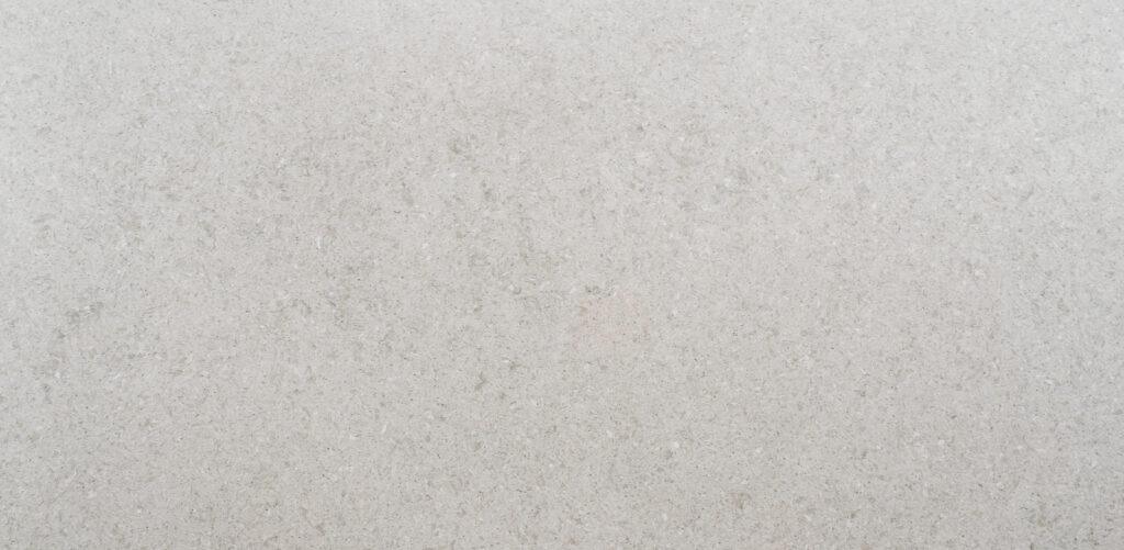 Vulcano worktop sample — pale greige with fine speckles and a limestone-inspired texture