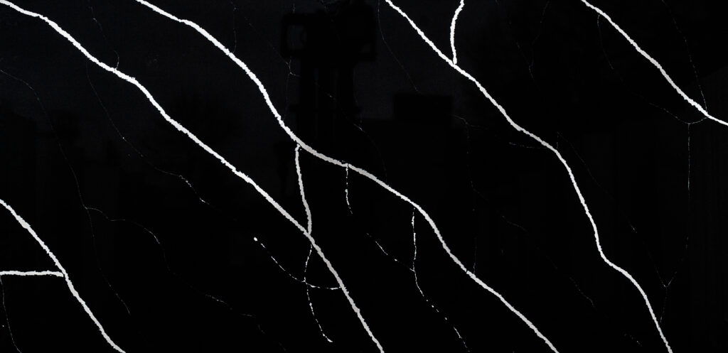 Nero Marquina quartz worktop sample – jet black with bold white diagonal veining